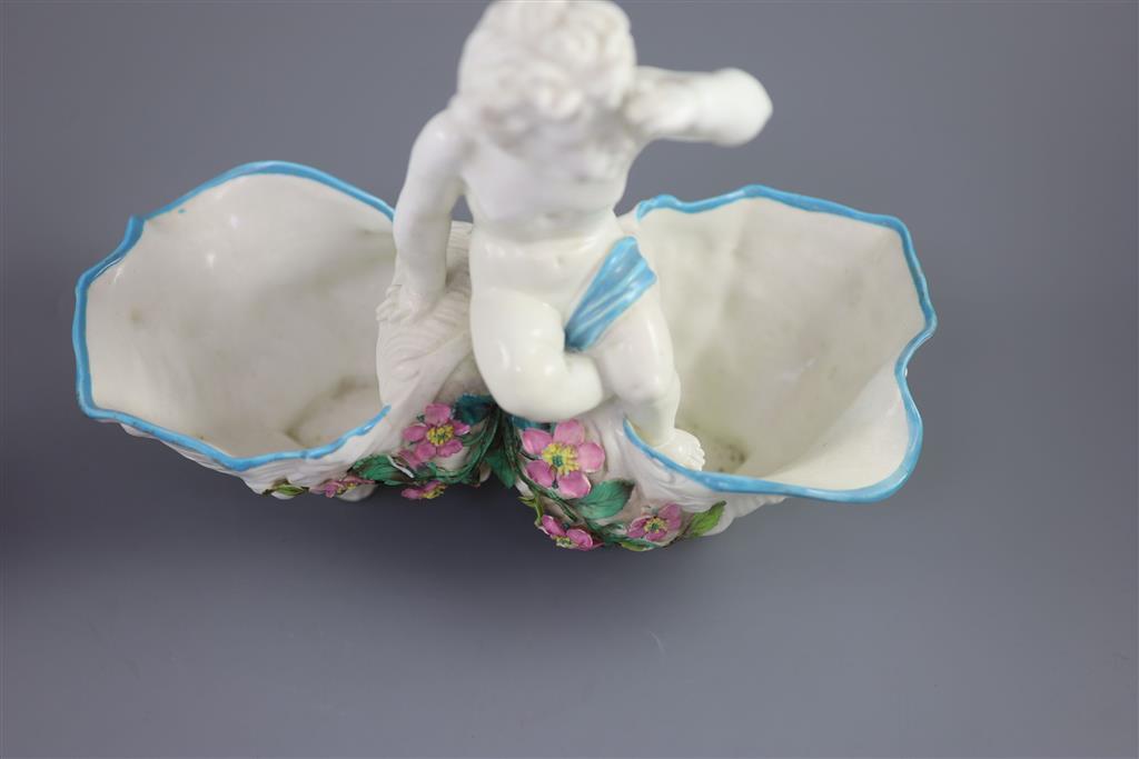 A large late 19th century French porcelain figure of Cupid, an English bone china cherub vase and a similar sweetmeat dish, tallest 3